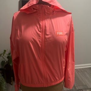 Pink women’s Victoria’s Secret wind breaker.